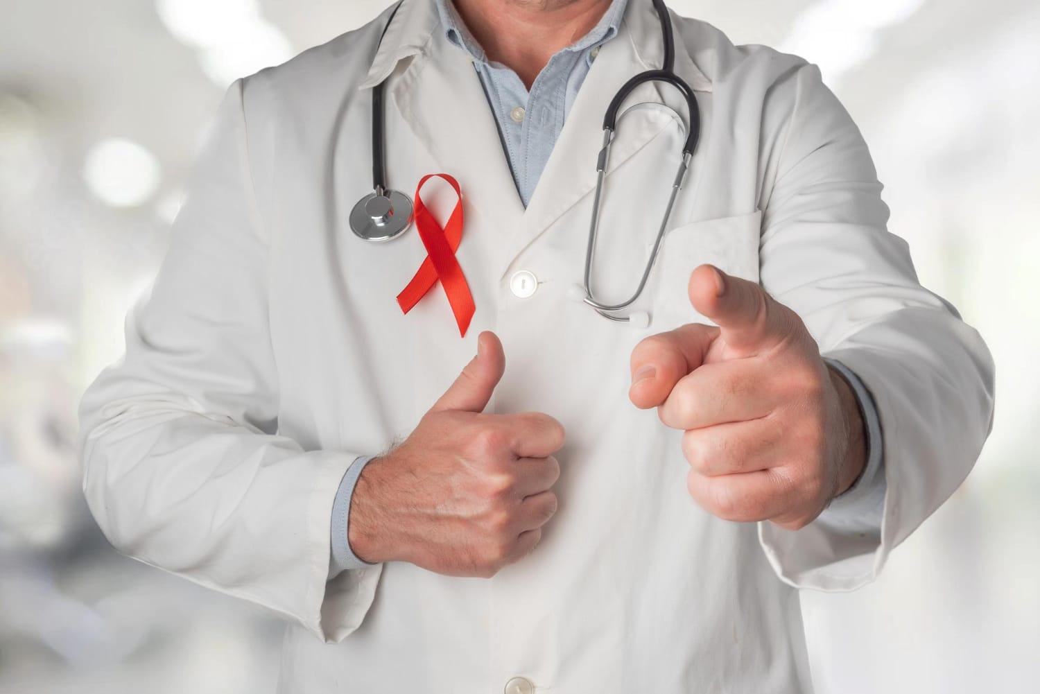 HIV treatment expert. A doctor holding a stethoscope with a badge of HlV red cross 
