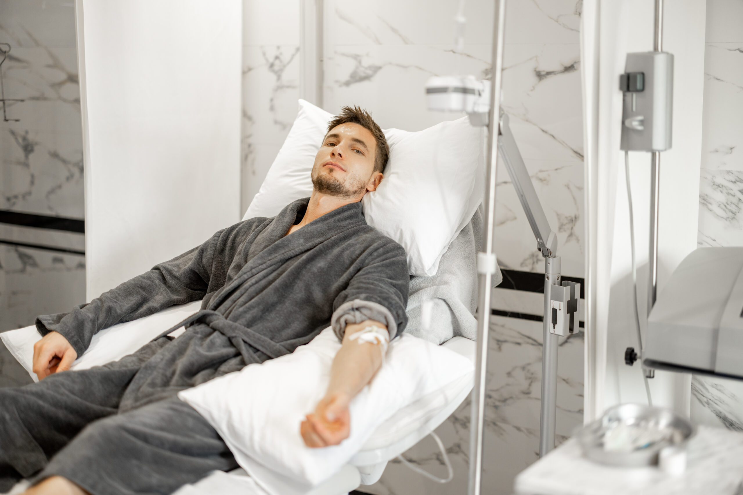 Patient receiving stem cell IV drip and vitamin therapy at H.U.M. Clinic