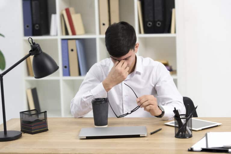 Office worker experiencing daytime sleepiness and fatigue at desk