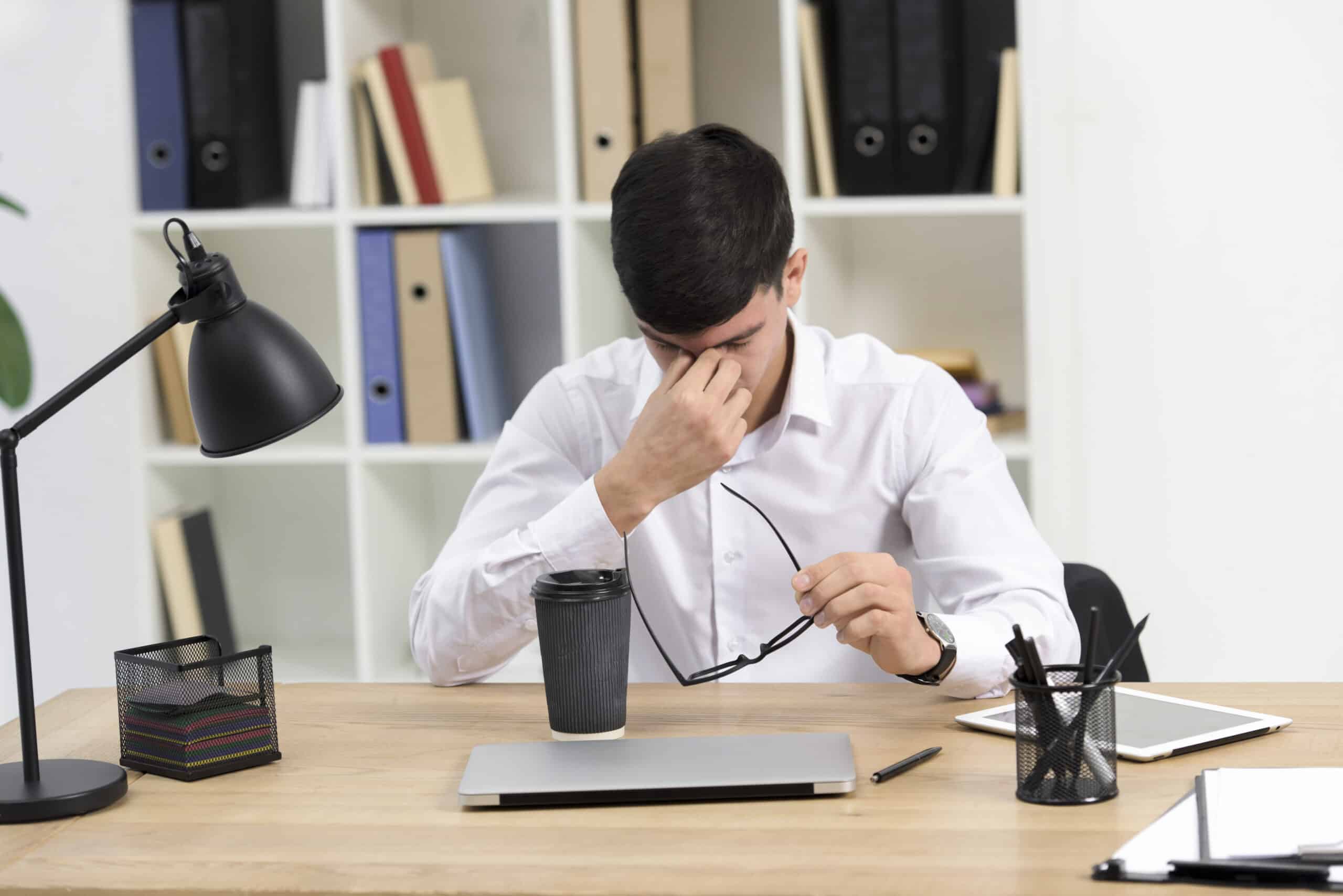 Office worker experiencing daytime sleepiness and fatigue at desk