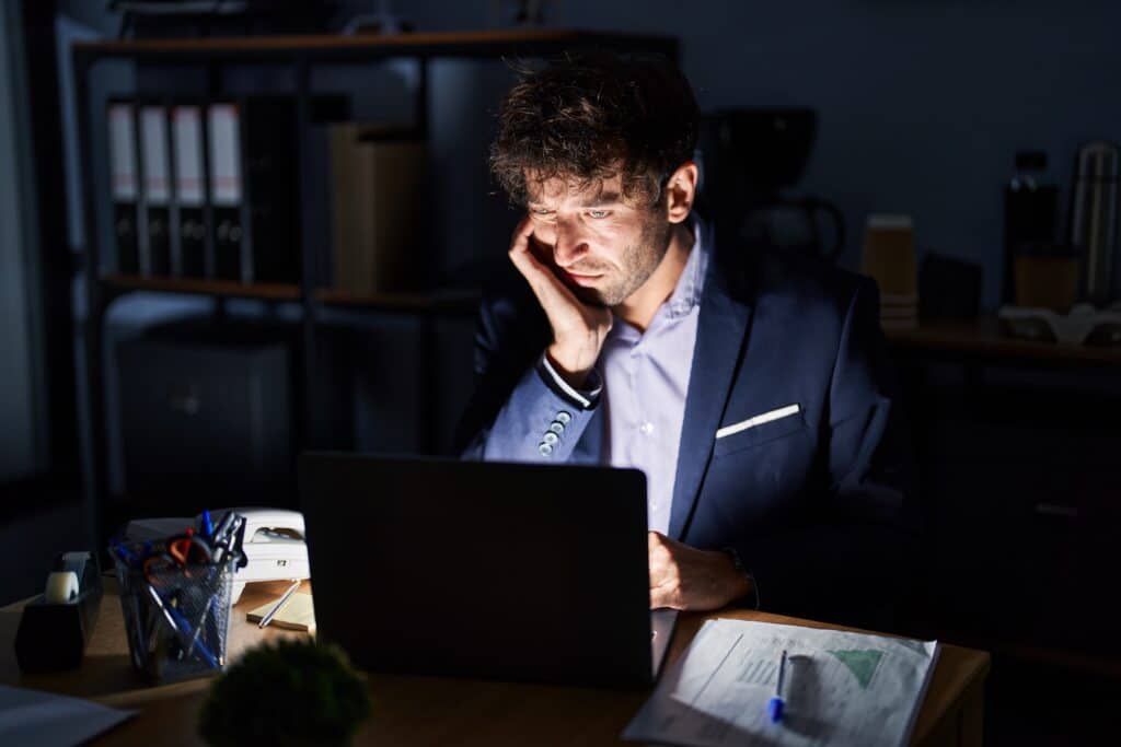 Night shift worker experiencing fatigue and reduced alertness at office