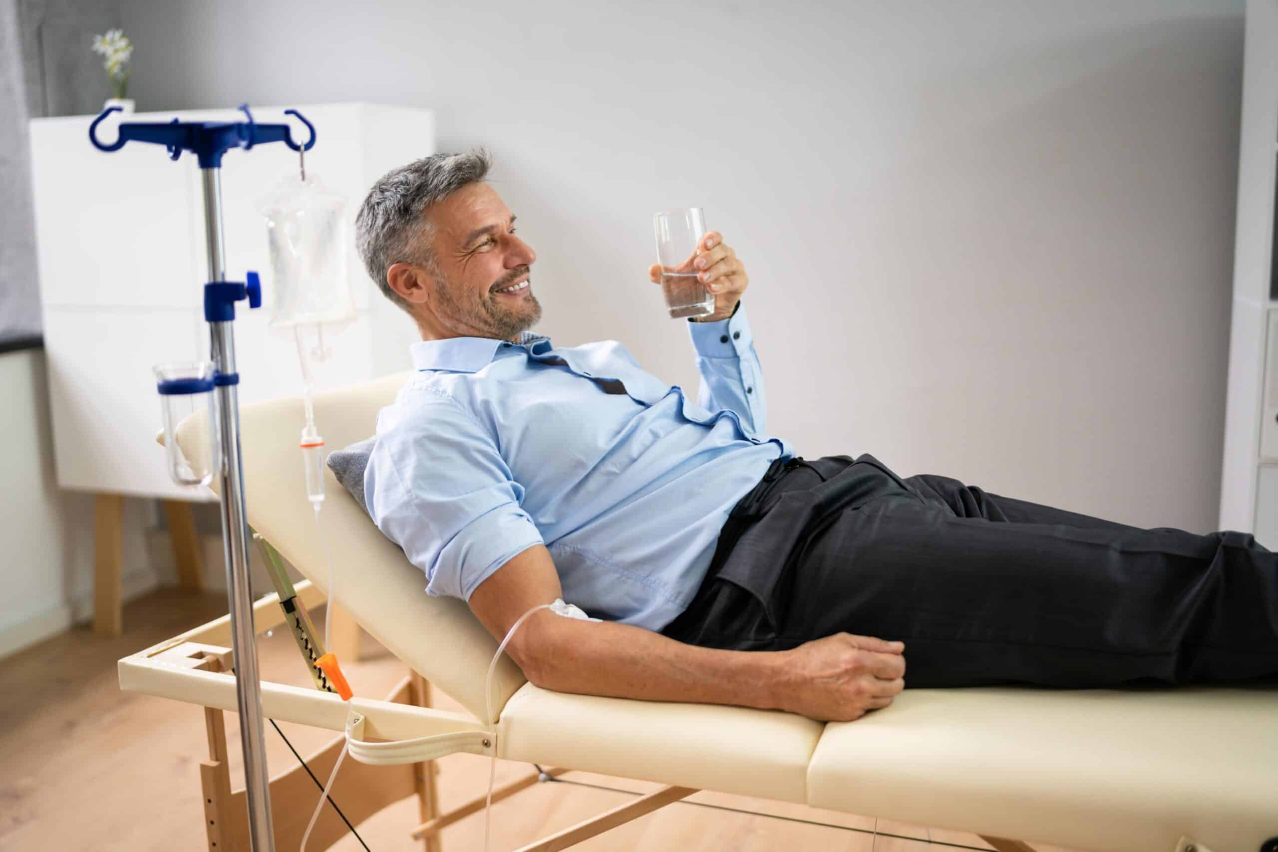 Man receiving IV drip therapy at a clinic in Bangkok