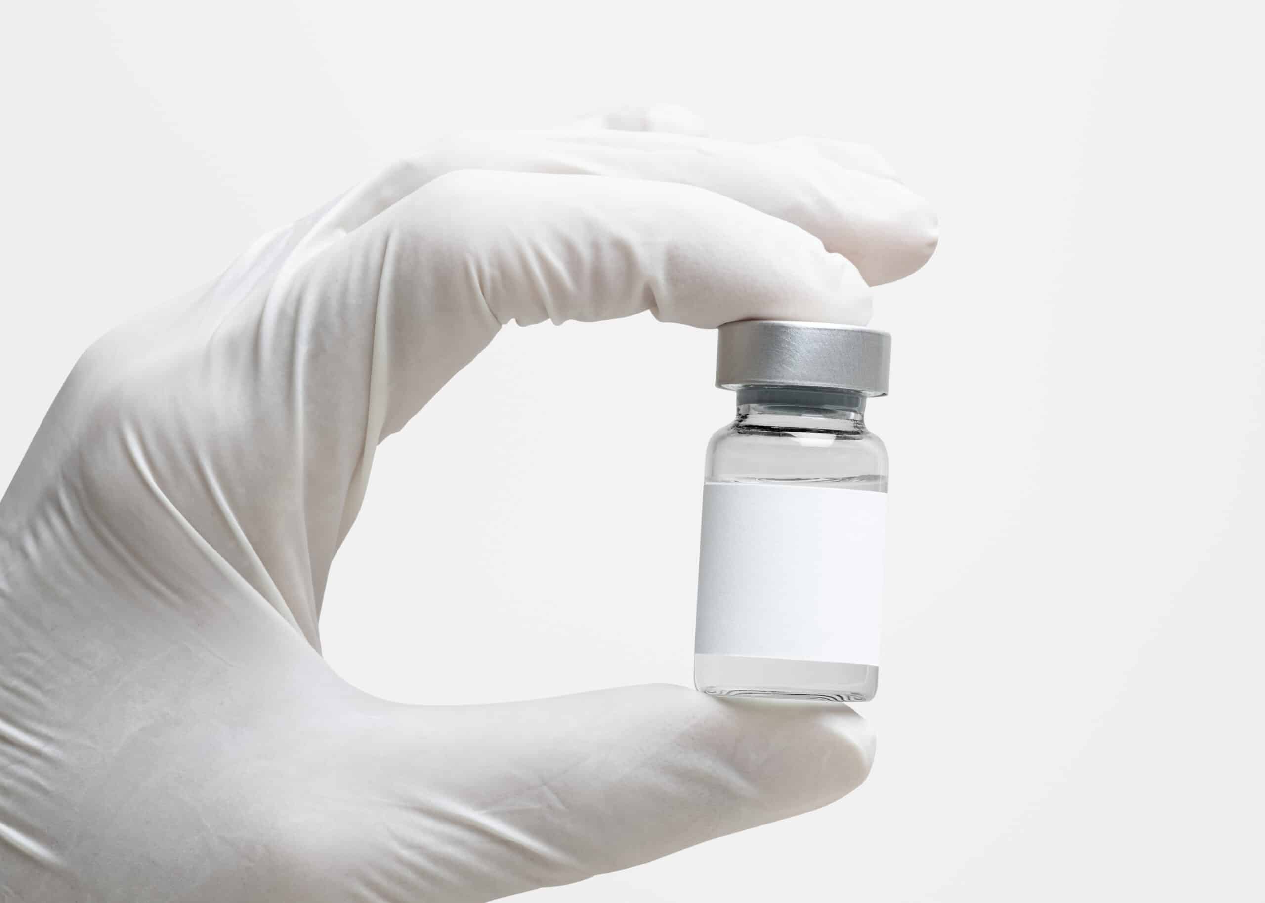 Medical-grade retatrutide peptide vial held by physician at H.U.M. Clinic Bangkok