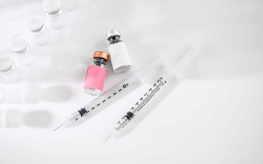 Vials of growth hormone peptide and HGH.