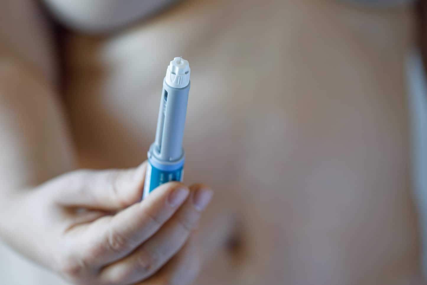 A patient holding a prescription weight loss injection available in Bangkok.