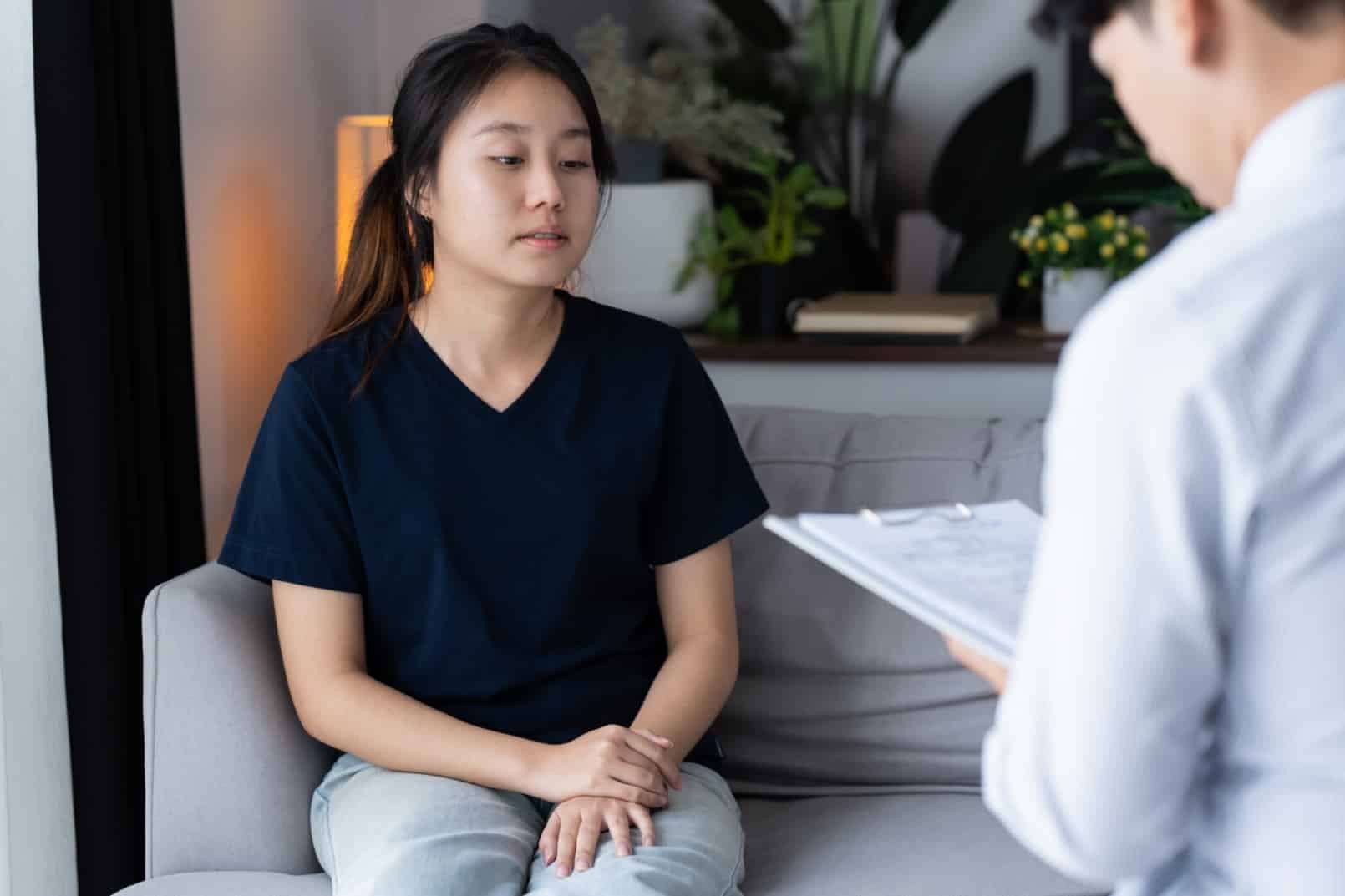 A patient in consultation with a doctor, discussing types of depression and burnout recovery.