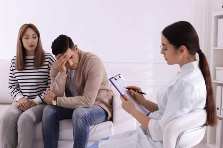 Couple attending a consultation to discuss trichomoniasis treatment