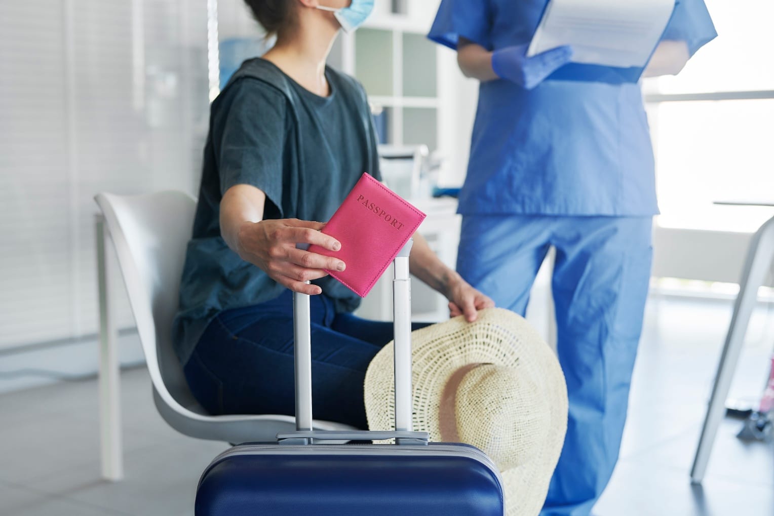 Traveler with passport and luggage at a clinic in Thailand for medical tourism