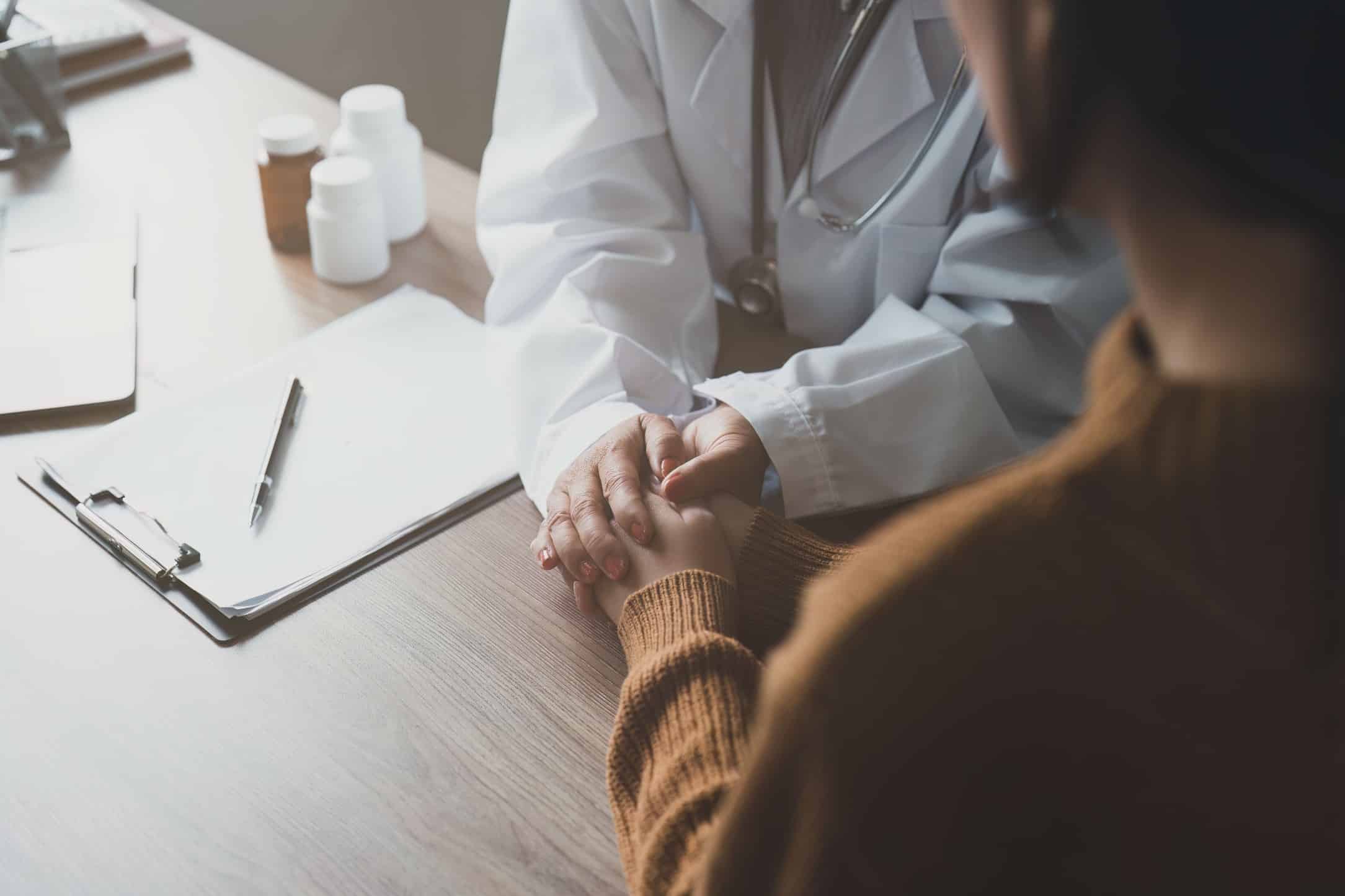 Physician consulting a patient about peptide therapy options
